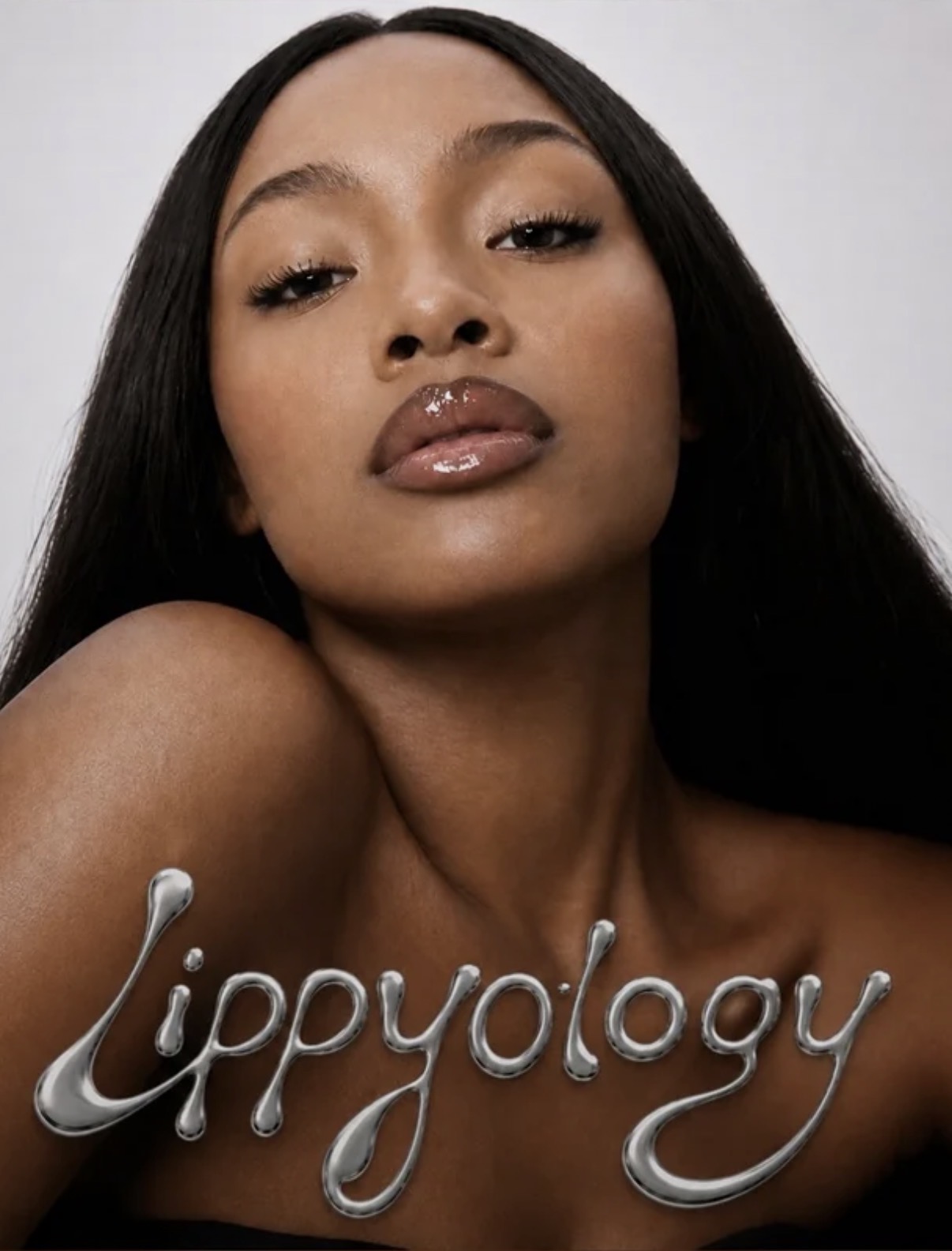 Close-up beauty portrait with glossy lips and the LIPPYOLOGY wordmark